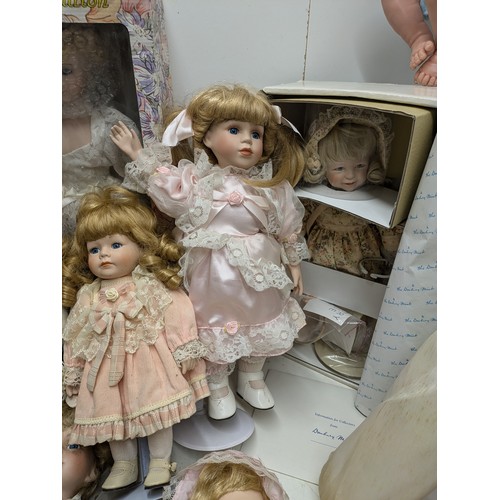 1101 - A Selection Of Porcelain Dolls including 4 Boxed and Several loose