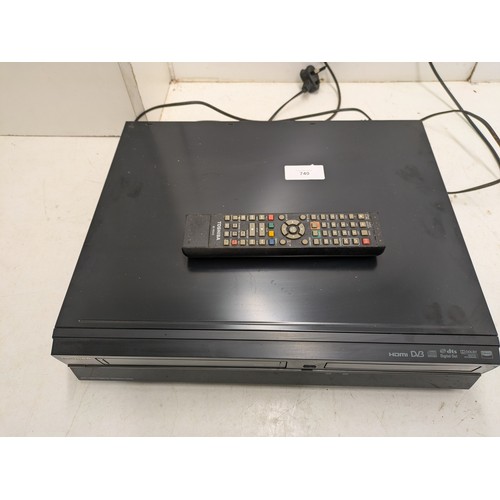 740 - A Toshiba Model DVR20 DVD/VCR Player And Recorder With Remote