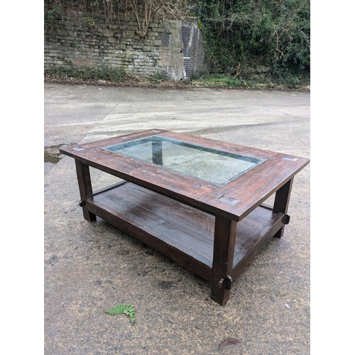 245 - A Rustic Style Stained Oak Coffee Table With Glass Top