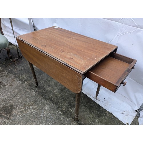 266 - A Late 19th Century Drop Leaf Table With 1 Drawer And Brass Castors