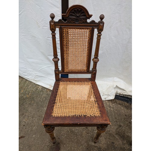 276 - a pair of antique chairs - stained oak, one rural design and one ornate with wicker base and back