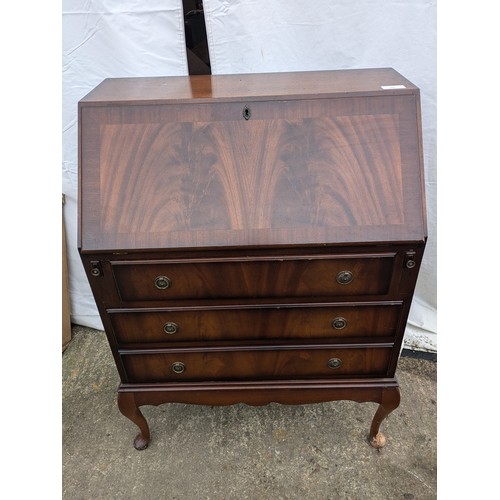 285 - an antique inspired verniered oak bureau