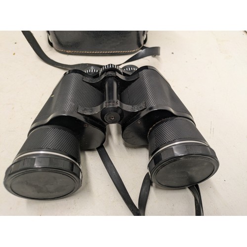 488 - A Pair Of Prinzlux 10X50 Coated Binoculars In Leather Case