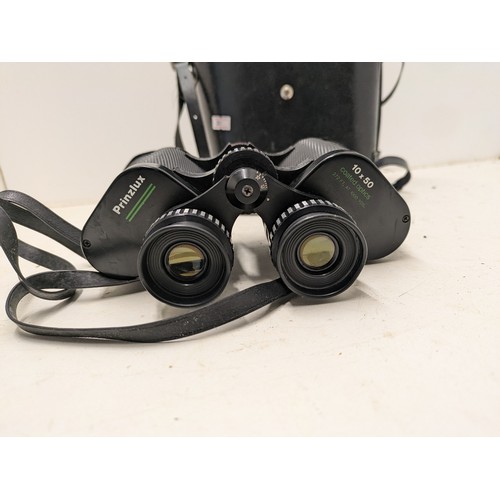 488 - A Pair Of Prinzlux 10X50 Coated Binoculars In Leather Case