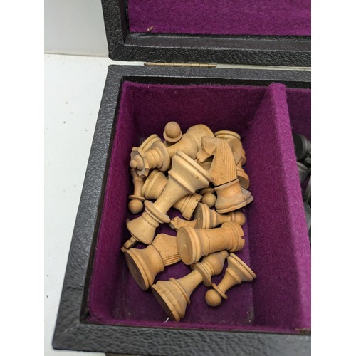 493 - A Leather Covered Box Containing A Set Of Wood Turned Chess Pieces, And A Light Wood Chess Board - C... 