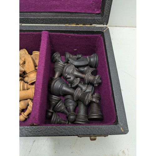 493 - A Leather Covered Box Containing A Set Of Wood Turned Chess Pieces, And A Light Wood Chess Board - C... 