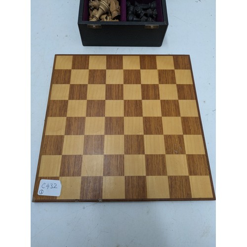 493 - A Leather Covered Box Containing A Set Of Wood Turned Chess Pieces, And A Light Wood Chess Board - C... 