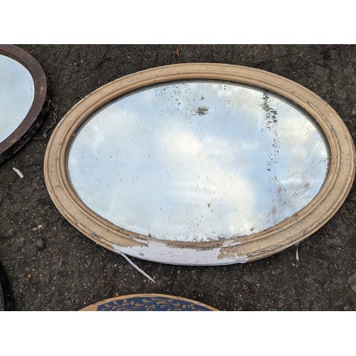 521 - a selection of vintage oval mirrors including guilded and verniered frames