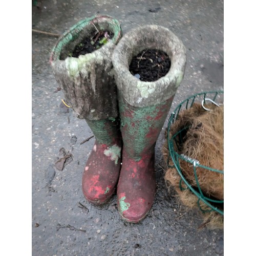 110 - a Concrete wellington boots plant pot and a pair of hanging baskets