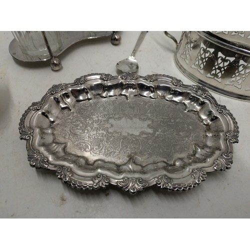 1180 - an assortment of silver plated items including a salt and pepper set