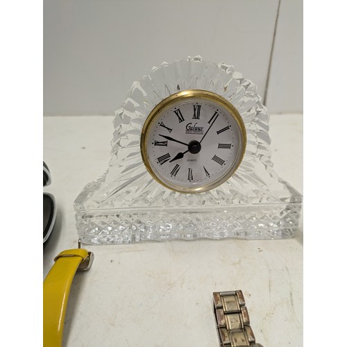 1182 - an assortment of quartz clocks and 2 wristwatches