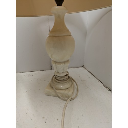 748 - A Pair Of Granite Table Lamps With Cream Shades