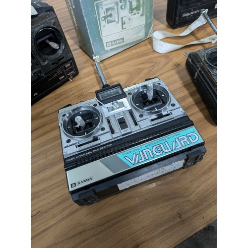 639 - A Selection of 5 RC Handheld Remotes including a Boxed Sanwa Mini Propo