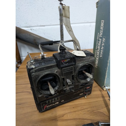 639 - A Selection of 5 RC Handheld Remotes including a Boxed Sanwa Mini Propo