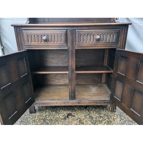 251 - A Vintage Carved Welsh Dresser with 2 Drawers and a Cupboard Space