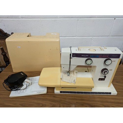 602 - A Riccar Model 9900 Sewing Machine With Case and Pedal