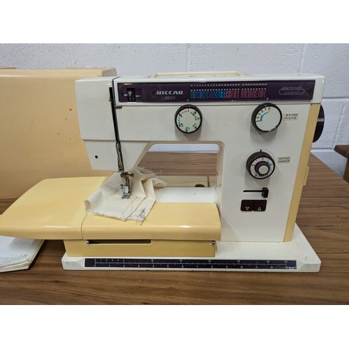 602 - A Riccar Model 9900 Sewing Machine With Case and Pedal