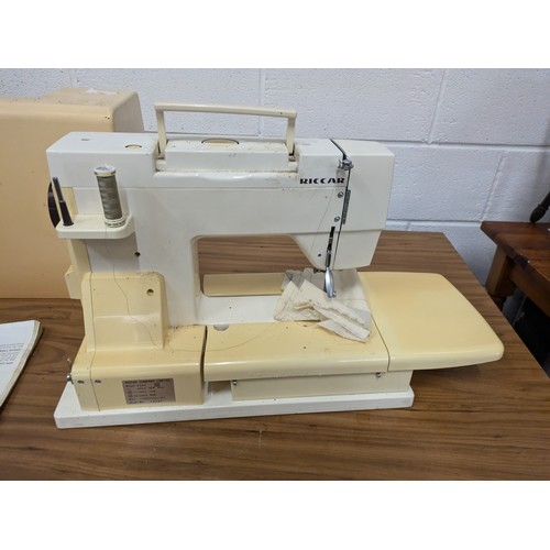 602 - A Riccar Model 9900 Sewing Machine With Case and Pedal