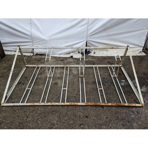 40 - A white metal bike rack