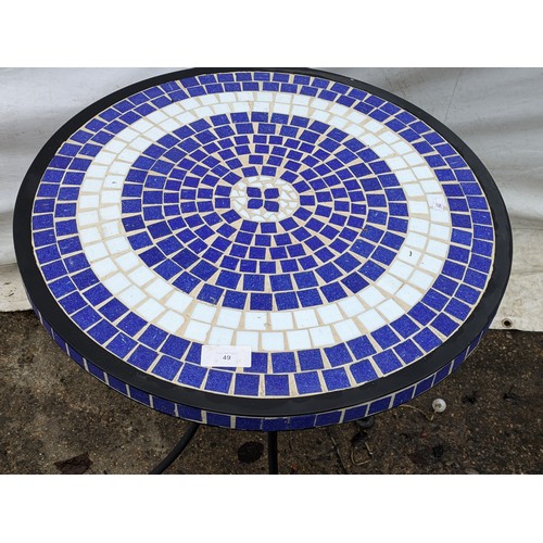 49 - A Blue And White Metal Tile Topped Table