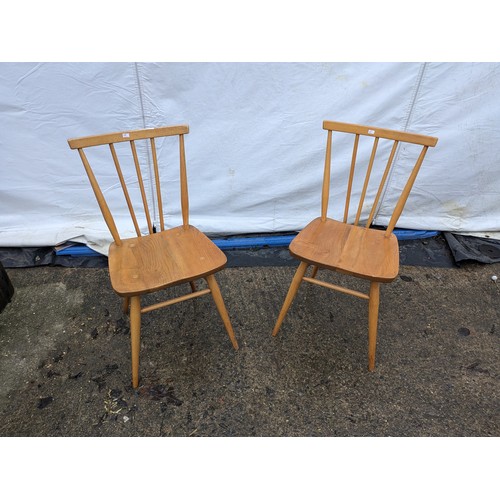 239 - A Pair of Ercol Style Pine Chairs