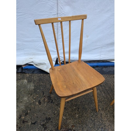 239 - A Pair of Ercol Style Pine Chairs