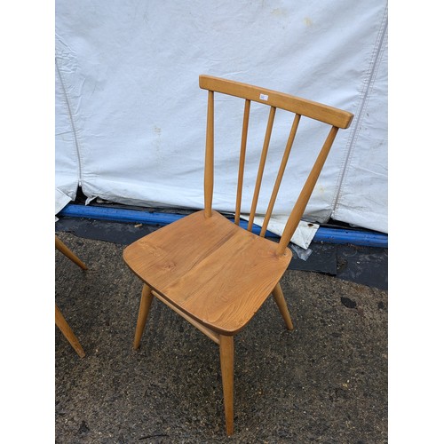 239 - A Pair of Ercol Style Pine Chairs