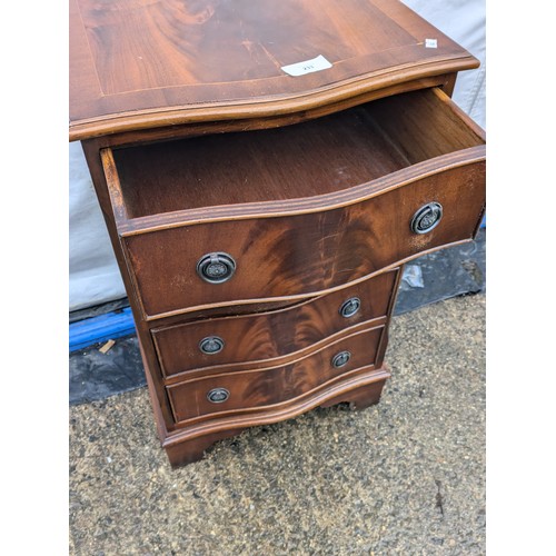 233 - A bow Fronted Walnut 4 Drawer Bedside Table