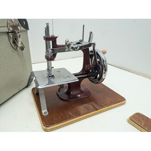 423 - A Vintage Miniature Sewing Machine In Carry Case