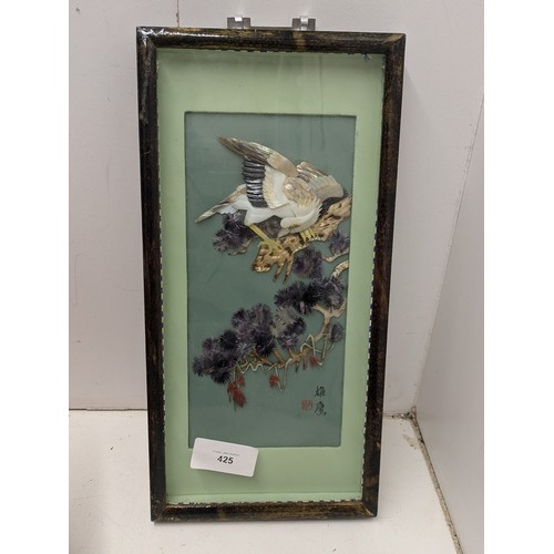 425 - An oriental Cork display in a frame