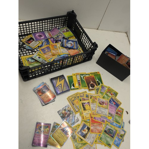 1021 - A large selection of vintage Pokemon cards and modern Pokemon cards and accessories