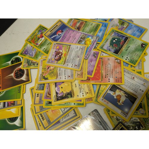 1021 - A large selection of vintage Pokemon cards and modern Pokemon cards and accessories