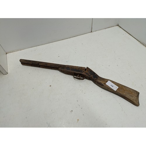 436 - A a vintage spring action double barrel toy shotgun