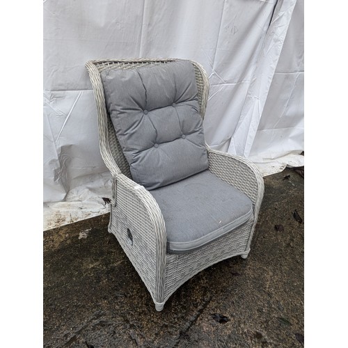 63 - A Grey Wicker Reclining Armchair and Grey Pillows