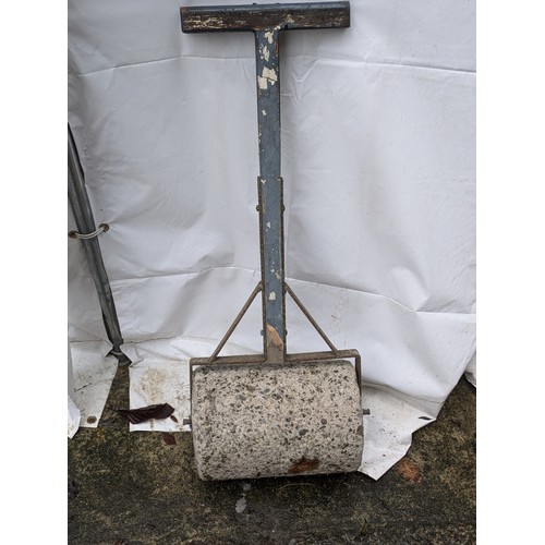 85 - A Concrete Garden Roller With A Wooden Handle