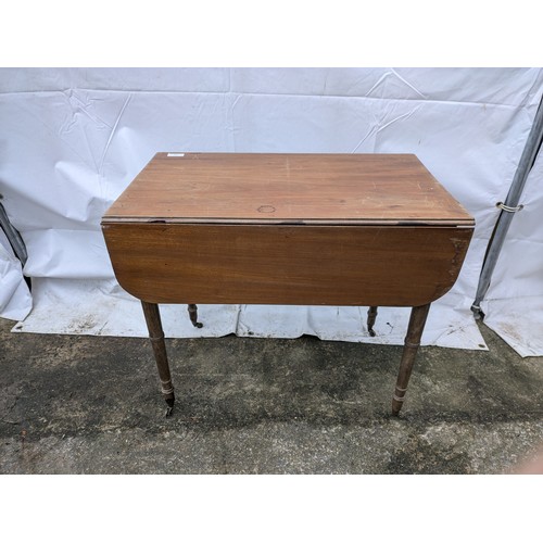 266 - A Late 19th Century Drop Leaf Table With 1 Drawer And Brass Castors