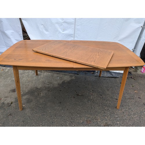 283 - a retro style verniered oak dining table with removable extension