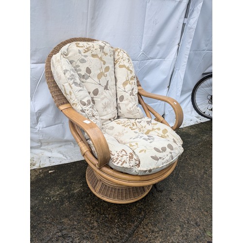 296 - A Wicker and Oak Vernier Lounge Chair, With Gold And Cream Floral Patterned Cushioms