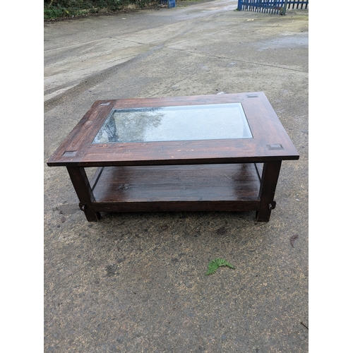 309 - A Rustic Style Stained Oak Coffee Table With Glass Top