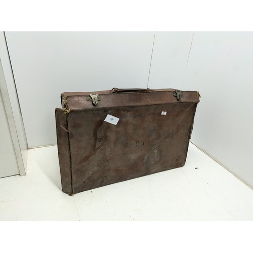 534 - A Vintage Leather Bound Suitcase With Brass Latches - Inscribed MBC