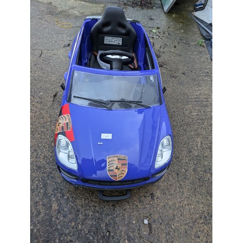 217 - A Porsche children's ride along remote controller car with charger and sound system- fully working