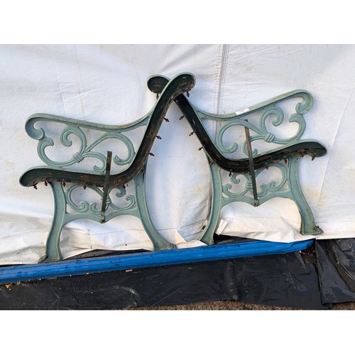 242 - A pair of cast iron bench ends