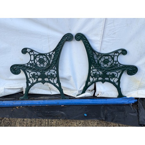 243 - A pair of cast iron bench ends