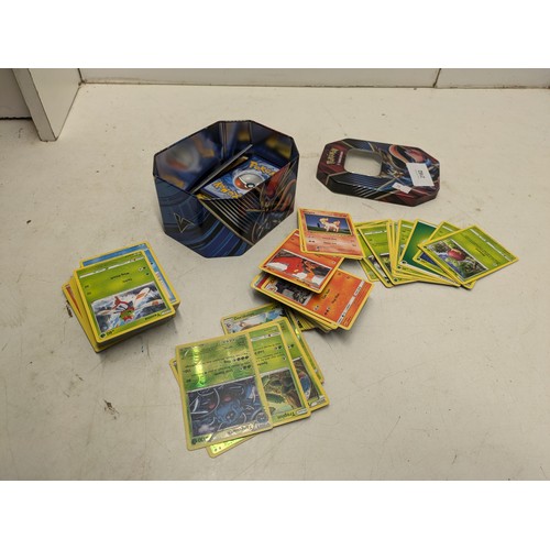 2162 - A tin of Pokémon cards