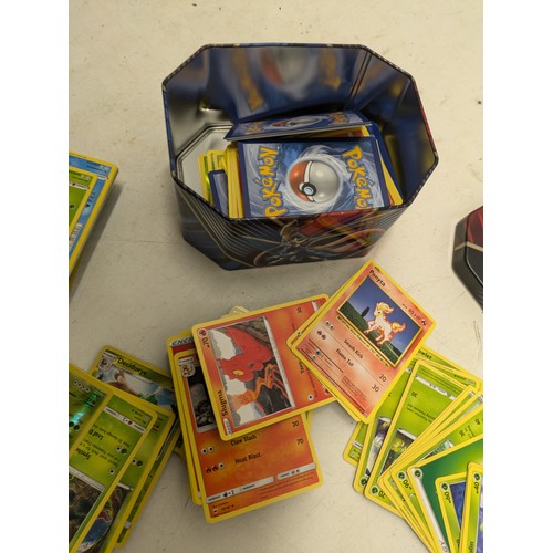 2162 - A tin of Pokémon cards