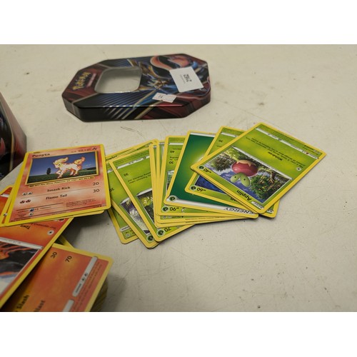 2162 - A tin of Pokémon cards