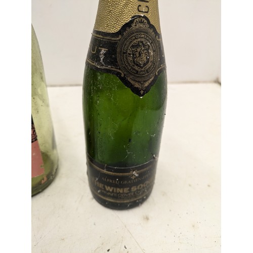 825 - A Selection of 4 Champagne Bottles Including Alfred Gratien, Gotes du Rhone