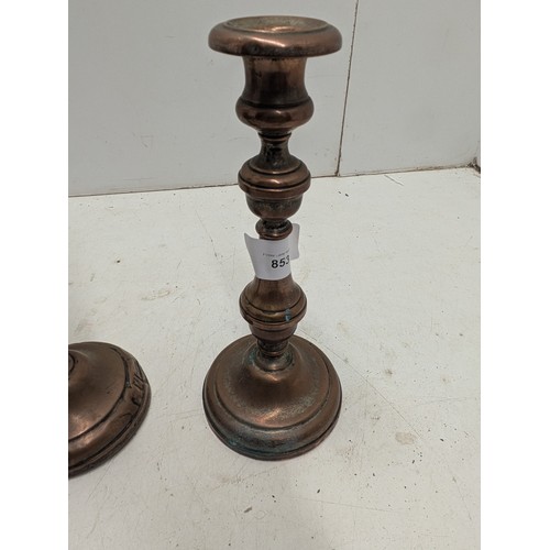 853 - A Pair of Antique Copper Candle Sticks