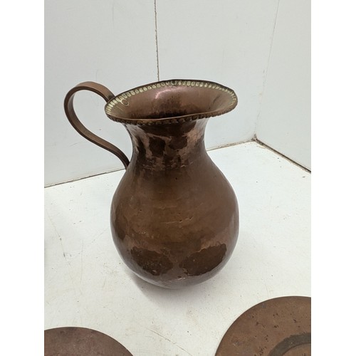 852 - A Large Collection of Antique Copper including Jugs, Plates Etc