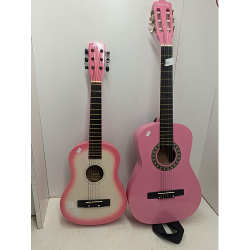 1860 - A Pair of Half Sized Pink Acoustic Guitars